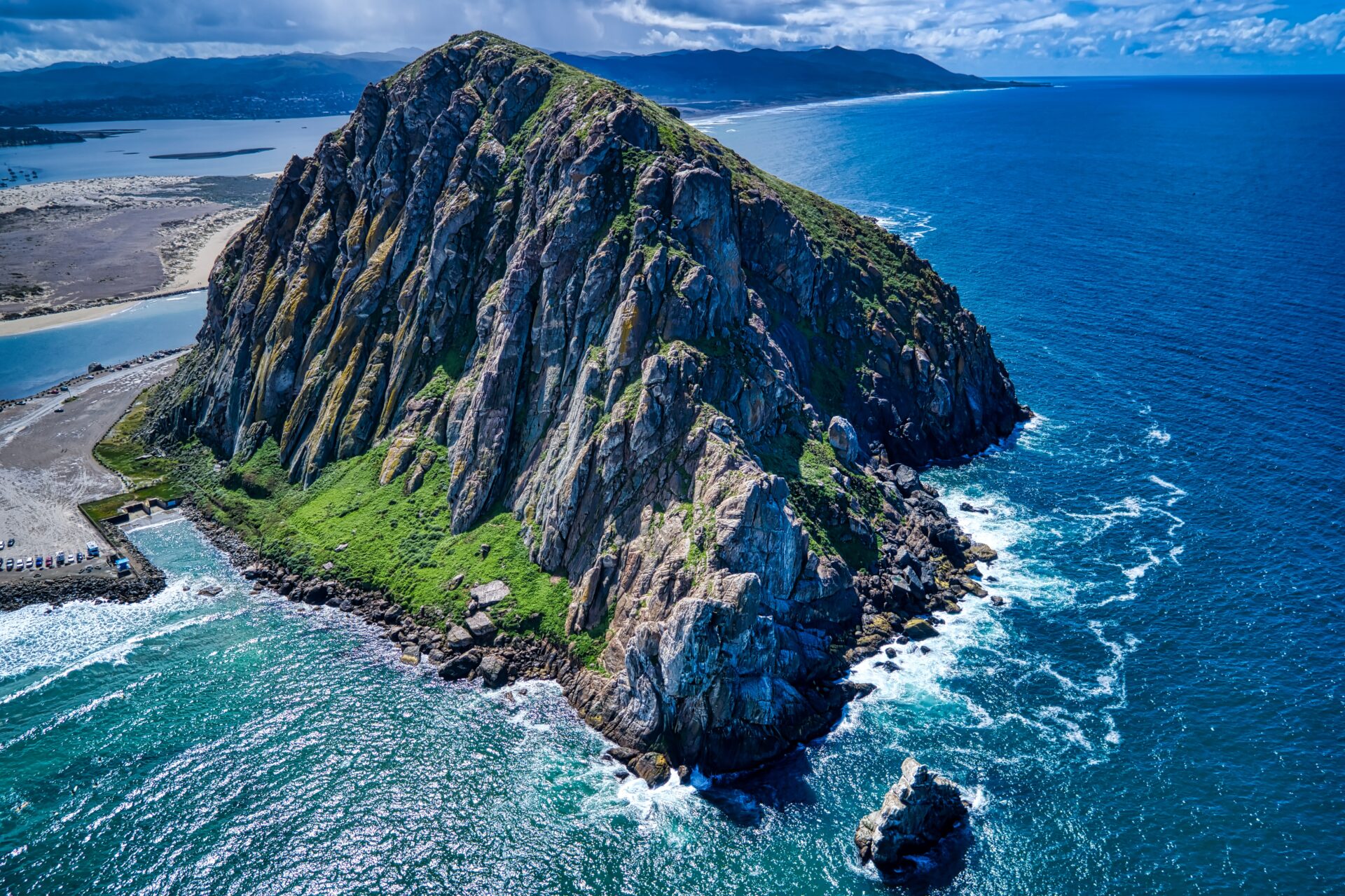 An aerial shot of the Morro Rock in California at midday